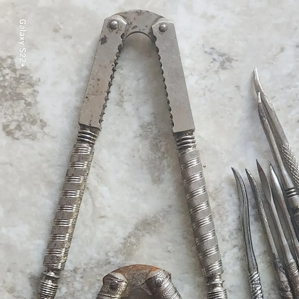 Silver metal Vintage Embossed Nutcracker & Six Picks set